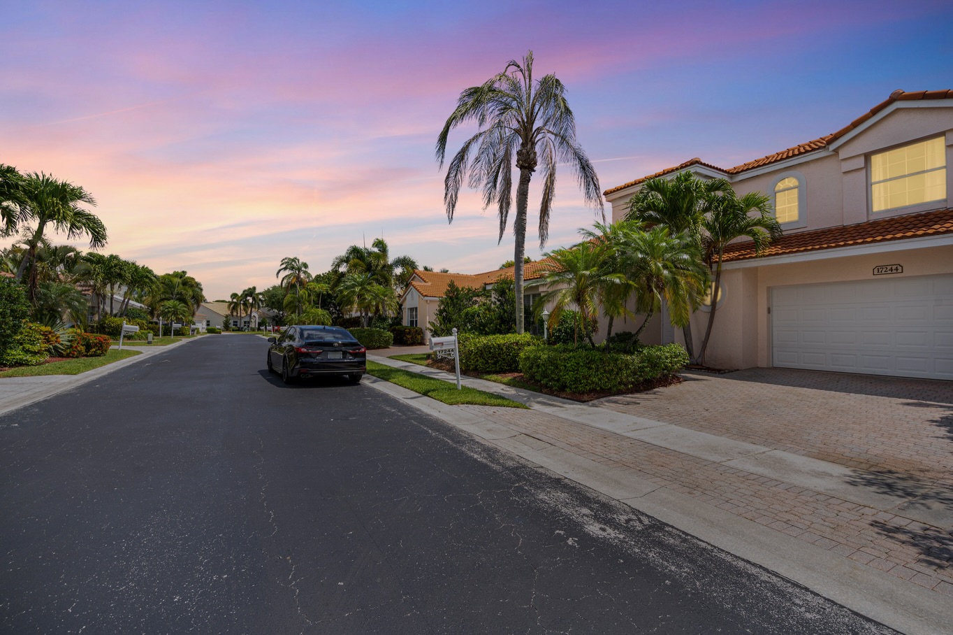 Coconut Creek residential street at twilight with palm trees