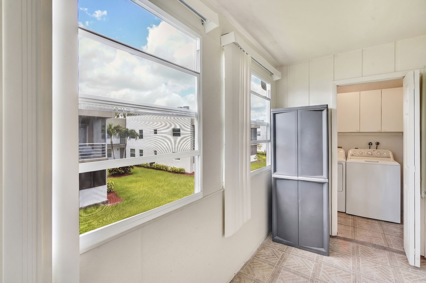 Florida room with HDR window pull preserving outdoor view